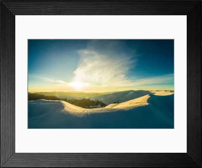 Framed Print : Majestic snowy hills located in the mountains on a sunny winter day with blue sky at a ski resort in Europe Framed Print : Majestic snowy hills located in the mountains on a sunny winter day with blue sky at a ski resort in Europe
