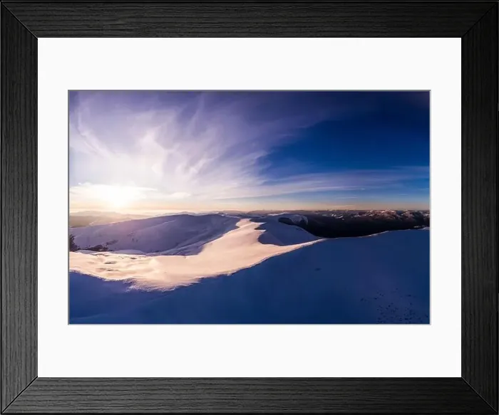 Framed Print : Fabulous evening panorama with snow-capped mountains and hills with bright sun and fog on a frosty winter evening Framed Print : Fabulous evening panorama with snow-capped mountains and hills with bright sun and fog on a frosty winter evening