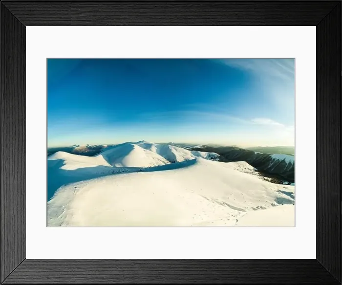 Framed Print : Top view of a beautiful mesmerizing view of the ski slope with ski trails located in the mountains on a sunny winter