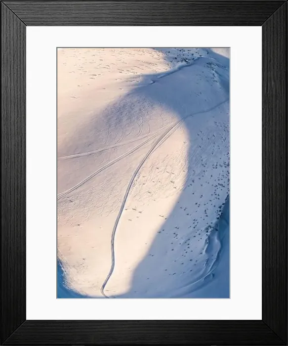 Framed Print : Top view of a beautiful mesmerizing view of the ski slope with ski trails located in the mountains on a sunny winter Framed Print : Top view of a beautiful mesmerizing view of the ski slope with ski trails located in the mountains on a sunny winter