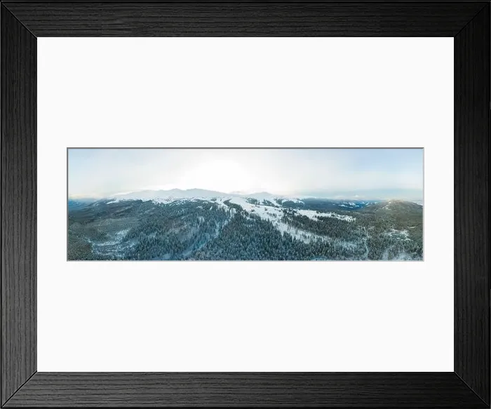 Framed Print : Aerial view of the stunning winter panorama of the snowy slopes and hills among the lush white clouds Framed Print : Aerial view of the stunning winter panorama of the snowy slopes and hills among the lush white clouds
