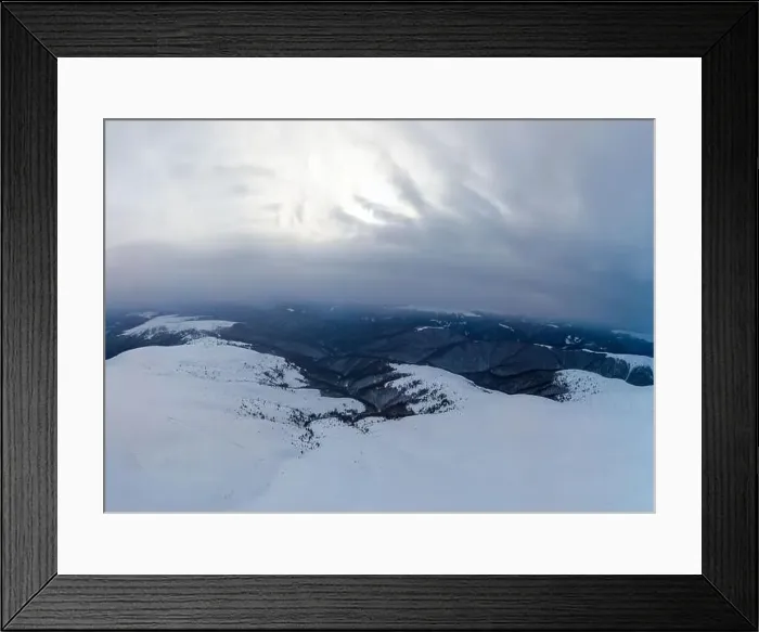 Framed Print : Stunning view of the cliffs covered with snow and trees on a cloudy winter day at the ski resort Framed Print : Stunning view of the cliffs covered with snow and trees on a cloudy winter day at the ski resort