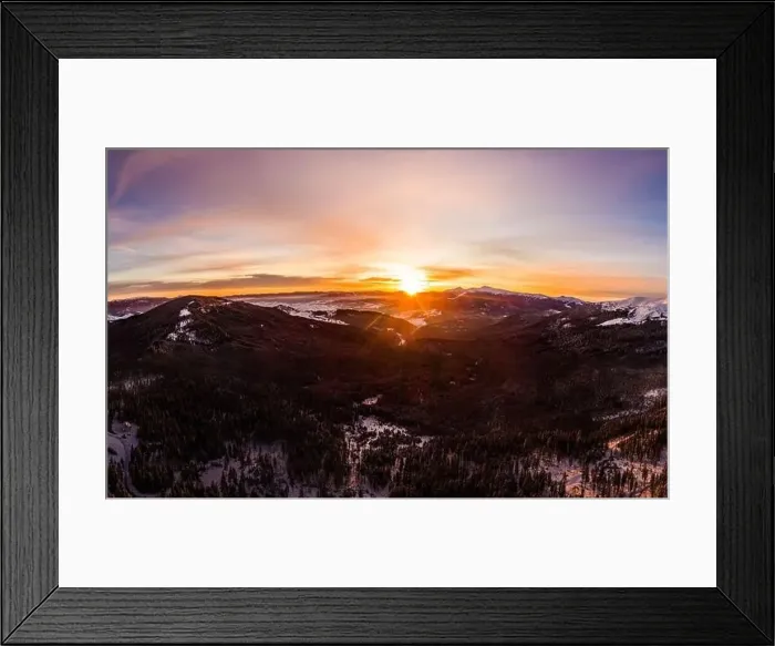 Framed Print : Top view of a magical view of a mountain winter forest with thick fir trees and hills in a beautiful pink winter sunset Framed Print : Top view of a magical view of a mountain winter forest with thick fir trees and hills in a beautiful pink winter sunset