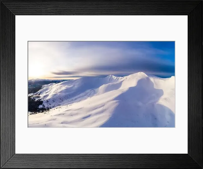 Framed Print : Aerial view of beautiful winter mountain slopes covered with snow and firs forest on a sunny cloudless day Framed Print : Aerial view of beautiful winter mountain slopes covered with snow and firs forest on a sunny cloudless day