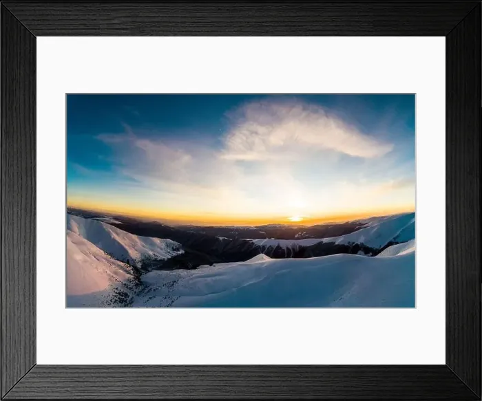 Framed Print : Bewitching view of the winter ski slopes on a winter sunny evening with shining sun and blue sky Framed Print : Bewitching view of the winter ski slopes on a winter sunny evening with shining sun and blue sky