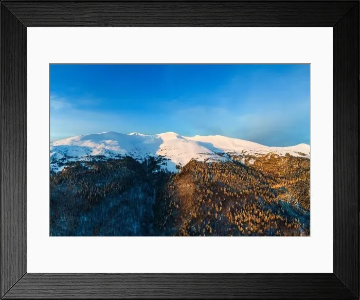 Framed Print : Aerial view amazing view of the mountains and slopes covered with dense thickets of fir trees Framed Print : Aerial view amazing view of the mountains and slopes covered with dense thickets of fir trees