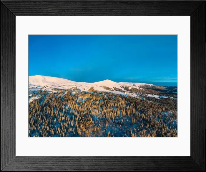 Framed Print : Stunning winter panorama with trees and hills covered with snow on a sunny frosty day Framed Print : Stunning winter panorama with trees and hills covered with snow on a sunny frosty day