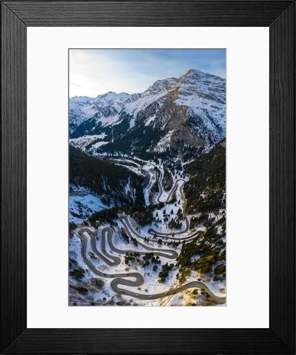 Framed Print : Aerial view of curves of Maloja Pass road, Bregaglia Valley, canton of Graubünden, Engadine, Switzerland Framed Print : Aerial view of curves of Maloja Pass road, Bregaglia Valley, canton of Graubünden, Engadine, Switzerland