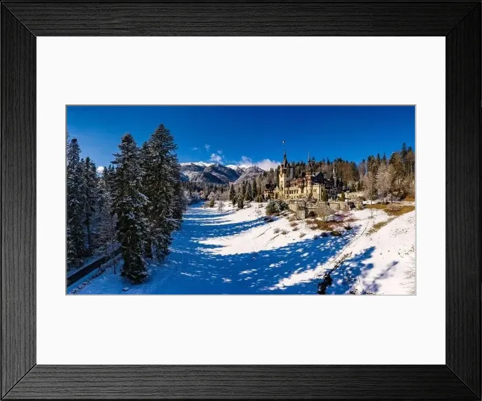 Framed Print : Aerial drone panoramic view of a beautiful Peles castle in Sinaia in the winter season, Transylvania, Romania Framed Print : Aerial drone panoramic view of a beautiful Peles castle in Sinaia in the winter season, Transylvania, Romania