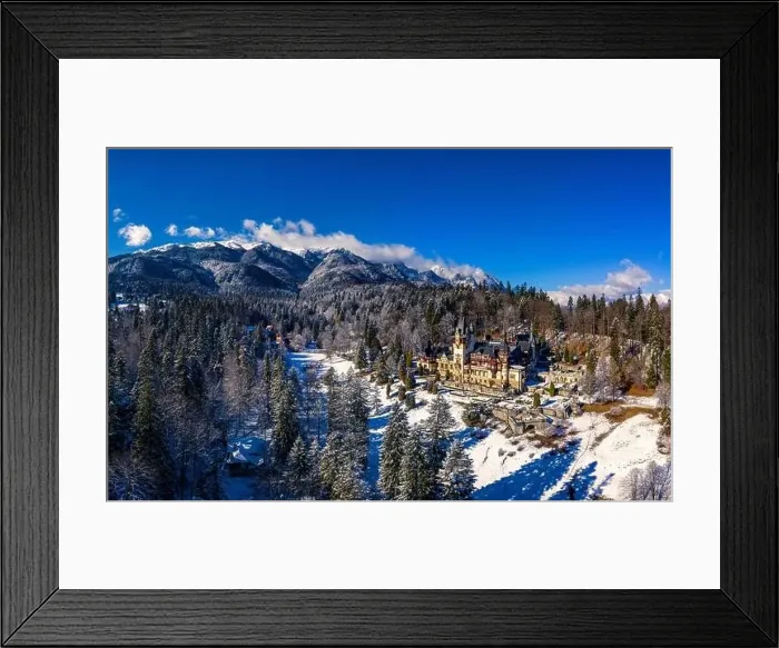 Framed Print : Aerial drone panoramic view of a beautiful Peles castle in Sinaia in the winter season, Transylvania, Romania Framed Print : Aerial drone panoramic view of a beautiful Peles castle in Sinaia in the winter season, Transylvania, Romania