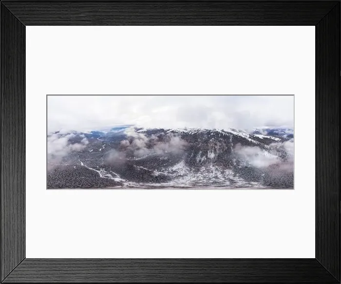 Framed Print : Bewitching beautiful panorama of mountains and hills covered with fir trees on a winter cloudy day Framed Print : Bewitching beautiful panorama of mountains and hills covered with fir trees on a winter cloudy day