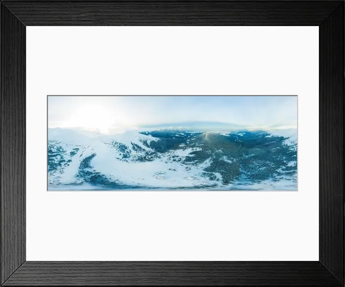 Framed Print : Fabulous evening panorama with snow-capped mountains and hills with bright sun and fog on a frosty winter evening Framed Print : Fabulous evening panorama with snow-capped mountains and hills with bright sun and fog on a frosty winter evening