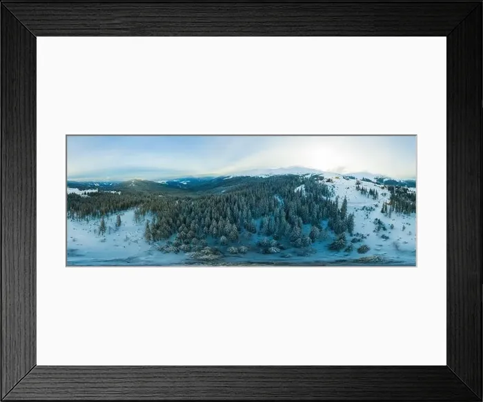 Framed Print : Fabulous evening panorama with snow-capped mountains and hills with bright sun and fog on a frosty winter evening Framed Print : Fabulous evening panorama with snow-capped mountains and hills with bright sun and fog on a frosty winter evening