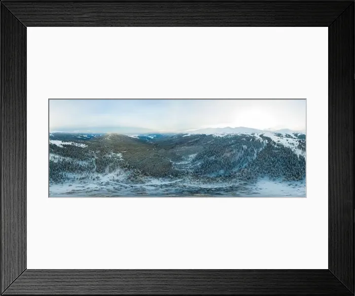 Framed Print : Bewitching beautiful panorama of mountains and hills covered with fir trees on a winter cloudy day Framed Print : Bewitching beautiful panorama of mountains and hills covered with fir trees on a winter cloudy day