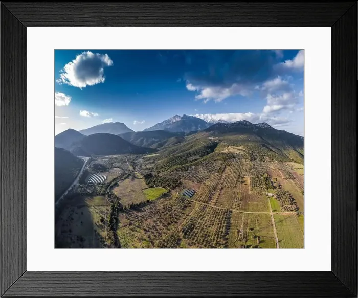 Framed Print : Aerial panorama of valley, morning fog over mountains, Twisting road, Tops and slopes of mountains Framed Print : Aerial panorama of valley, morning fog over mountains, Twisting road, Tops and slopes of mountains