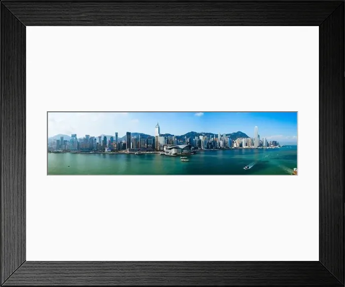 Framed Print : Aerial view of Hong kong skyline over the harbour during the afternoon in Summer Framed Print : Aerial view of Hong kong skyline over the harbour during the afternoon in Summer