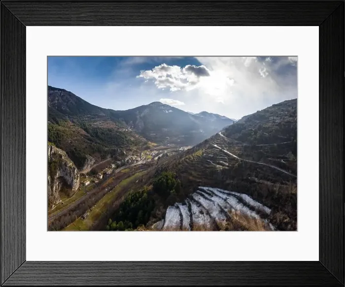 Framed Print : Aerial panoramic drone view of a scenic highway by the beautiful Landscape covered in clouds and fog Framed Print : Aerial panoramic drone view of a scenic highway by the beautiful Landscape covered in clouds and fog
