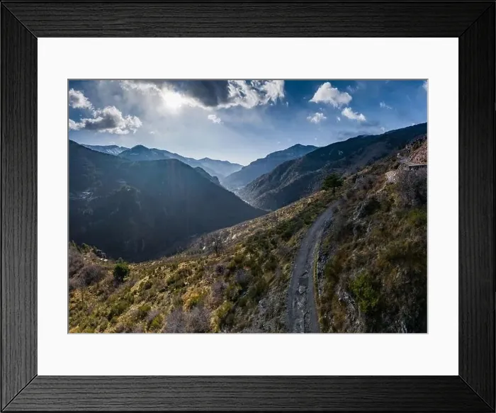 Framed Print : Aerial panoramic drone view of a scenic highway by the beautiful Landscape covered in clouds and fog Framed Print : Aerial panoramic drone view of a scenic highway by the beautiful Landscape covered in clouds and fog