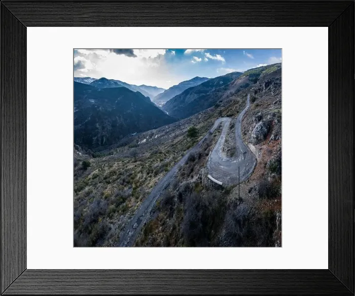Framed Print : Aerial panoramic drone view of a scenic highway by the beautiful Landscape covered in clouds and fog Framed Print : Aerial panoramic drone view of a scenic highway by the beautiful Landscape covered in clouds and fog