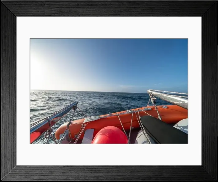Framed Print : sailing boat in Antarctica, yacht navigation through icebergs and sea ice Framed Print : sailing boat in Antarctica, yacht navigation through icebergs and sea ice