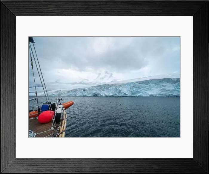 Framed Print : sailing boat in Antarctica, yacht navigation through icebergs and sea ice Framed Print : sailing boat in Antarctica, yacht navigation through icebergs and sea ice