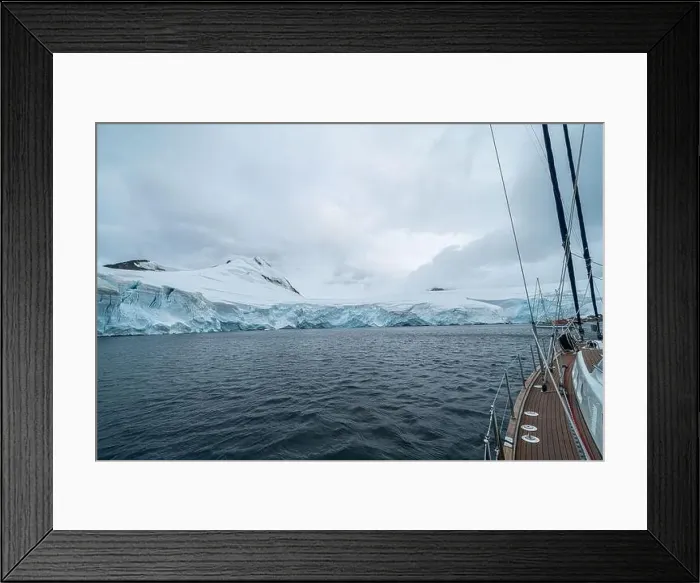 Framed Print : sailing boat in Antarctica, yacht navigation through icebergs and sea ice Framed Print : sailing boat in Antarctica, yacht navigation through icebergs and sea ice