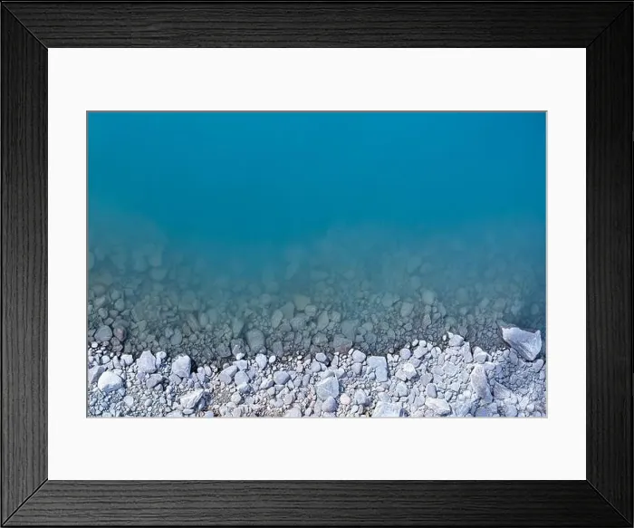 Framed Print : Aerial top view of turquoise lake and rocks abstract background at Tekapo, New Zealand