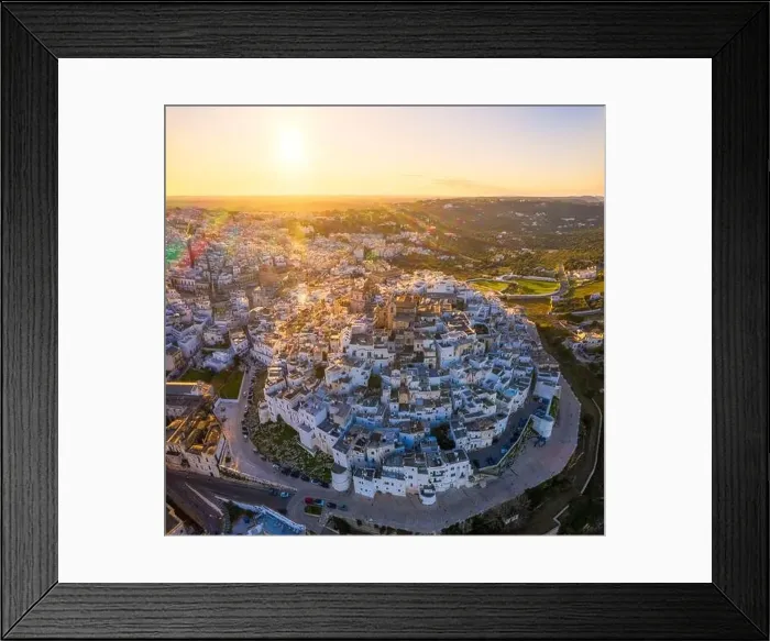 Framed Print : Aerial view by drone of the old town of Ostuni at sunset, Apulia, Italy, Europe Framed Print : Aerial view by drone of the old town of Ostuni at sunset, Apulia, Italy, Europe