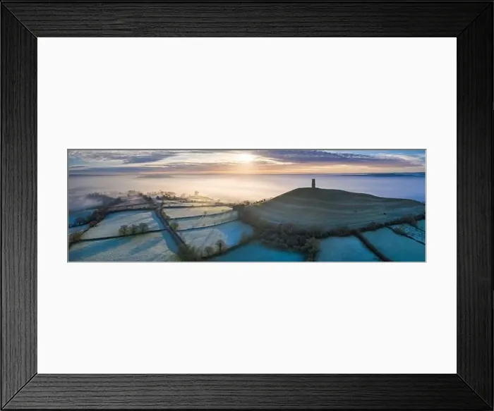 Framed Print : Aerial view by drone of frosty winter sunrise over Glastonbury Tor, Somerset, England, United Kingdom, Europe Framed Print : Aerial view by drone of frosty winter sunrise over Glastonbury Tor, Somerset, England, United Kingdom, Europe