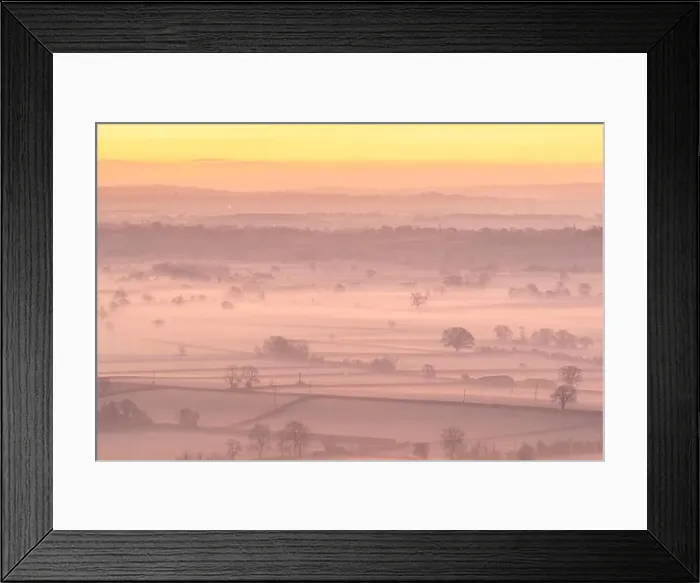 Framed Print : Dawn over the mist shrouded countryside of the Somerset Levels in winter Framed Print : Dawn over the mist shrouded countryside of the Somerset Levels in winter