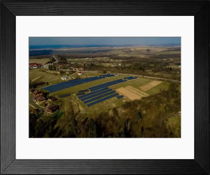 Framed Print : Aerial view of large field of solar photo voltaic panels system producing renewable clean energy on green grass Framed Print : Aerial view of large field of solar photo voltaic panels system producing renewable clean energy on green grass