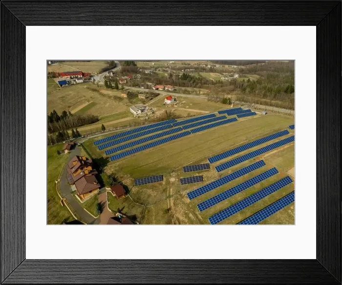 Framed Print : Aerial view of large field of solar photo voltaic panels system producing renewable clean energy on green grass Framed Print : Aerial view of large field of solar photo voltaic panels system producing renewable clean energy on green grass