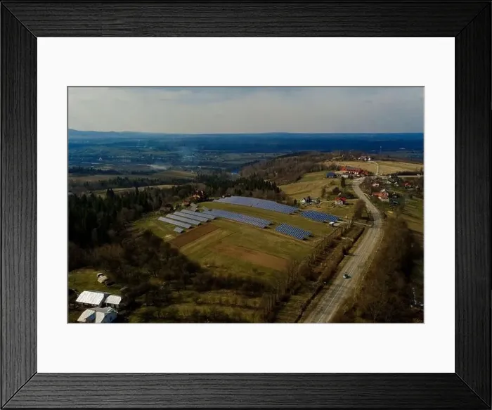 Framed Print : Aerial view of large field of solar photo voltaic panels system producing renewable clean energy on green grass Framed Print : Aerial view of large field of solar photo voltaic panels system producing renewable clean energy on green grass