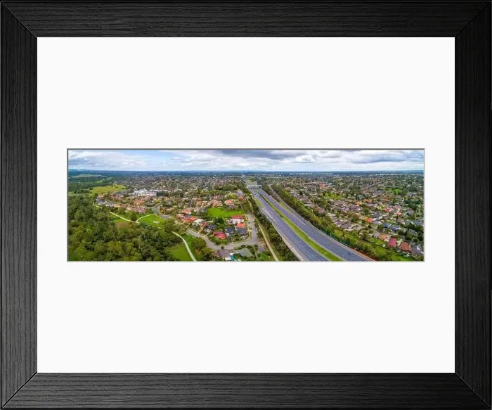 Framed Print : Eastlink highway passing through residential areas in Melbourne, Australia - aerial panorama Framed Print : Eastlink highway passing through residential areas in Melbourne, Australia - aerial panorama
