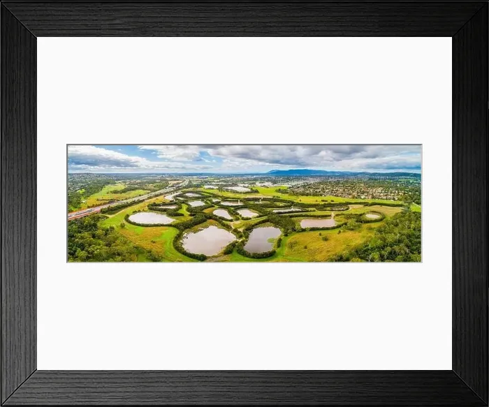 Framed Print : Scenic aerial panorama of nature reserve with water pools in Melbourne, Australia Framed Print : Scenic aerial panorama of nature reserve with water pools in Melbourne, Australia