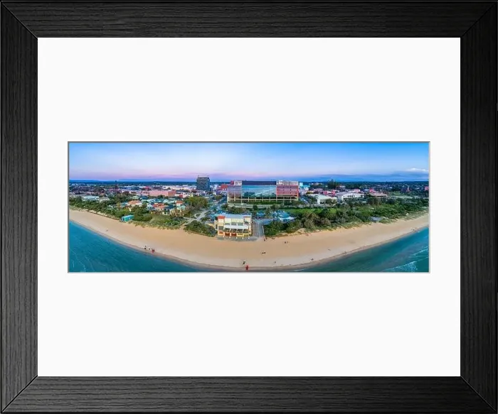 Framed Print : Wide aerial panorama of Frankston foreshore with the Waves restaurant and South East Water head office building at dusk