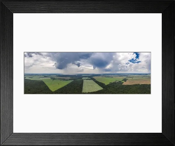 Framed Print : Rain over rural countryside aerial panorama. Rain clouds shot from a drone Framed Print : Rain over rural countryside aerial panorama. Rain clouds shot from a drone