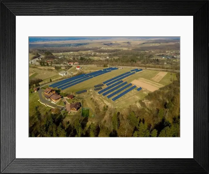 Framed Print : Aerial view of blue solar photo voltaic panels system producing renewable clean energy on rural landscape Framed Print : Aerial view of blue solar photo voltaic panels system producing renewable clean energy on rural landscape