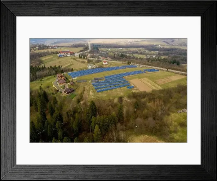 Framed Print : Aerial view of large field of solar photo voltaic panels system producing renewable clean energy on green grass Framed Print : Aerial view of large field of solar photo voltaic panels system producing renewable clean energy on green grass