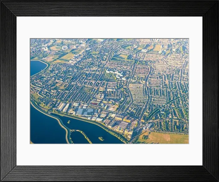 Framed Print : High angle above aerial bird's eye drone view from airplane over city of London in United Kingdom with terraced houses Framed Print : High angle above aerial bird's eye drone view from airplane over city of London in United Kingdom with terraced houses