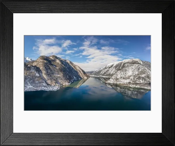 Framed Print : Aerial drone shot of ferry boat on Hallstatt lake with ripples in between snow mountains in Austria in winter before Framed Print : Aerial drone shot of ferry boat on Hallstatt lake with ripples in between snow mountains in Austria in winter before