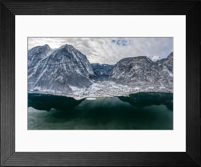 Framed Print : Aerial Drone shot of Lahn village by Hallstatt lake at foot of Austrian Alps mountain with clouds in winter