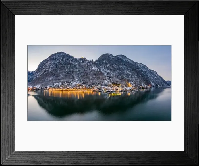 Framed Print : Aerial drone shot of snowy Hallstatt village by lake with lights Framed Print : Aerial drone shot of snowy Hallstatt village by lake with lights