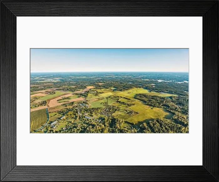 Framed Print : Warm aerial earth curve panorama view over rural village with residental Framed Print : Warm aerial earth curve panorama view over rural village with residental