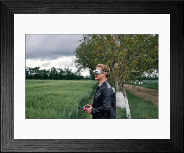 Framed Print : a man controls drone on the street Framed Print : a man controls drone on the street