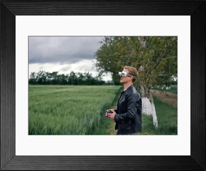 Framed Print : a man controls drone on the street Framed Print : a man controls drone on the street
