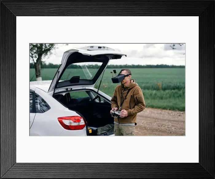 Framed Print : a man controls drone on the street Framed Print : a man controls drone on the street