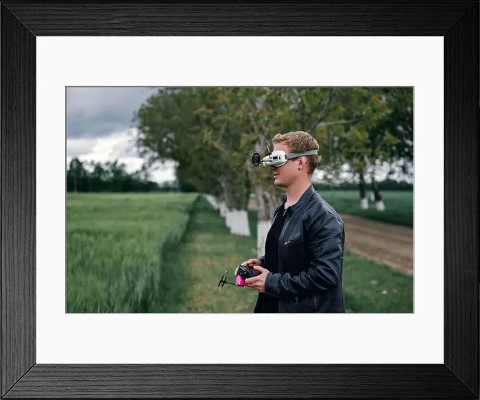 Framed Print : a man controls drone on the street Framed Print : a man controls drone on the street