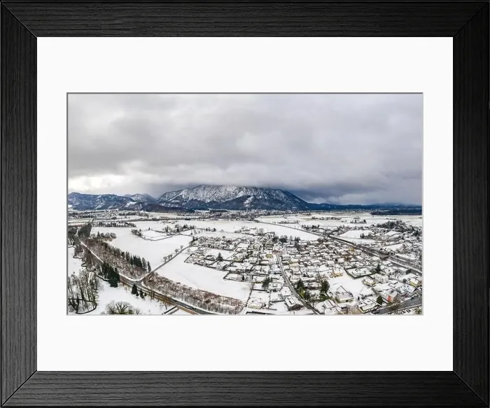 Framed Print : Aerial view of Austrian Alps valley village near Untersberg mountain and Salzburg outskirts in winter during heavy snow Framed Print : Aerial view of Austrian Alps valley village near Untersberg mountain and Salzburg outskirts in winter during heavy snow