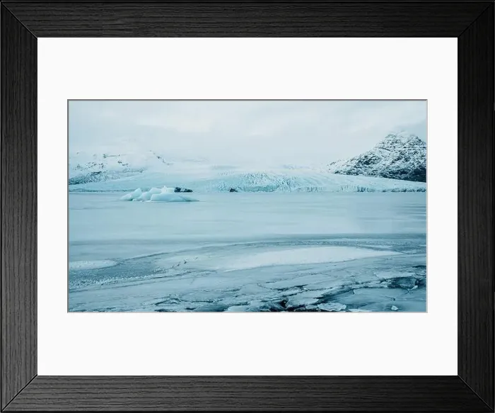 Framed Print : Breathtaking glacier in Iceland with black rock and large ice sheets, melting ice due to climate change Framed Print : Breathtaking glacier in Iceland with black rock and large ice sheets, melting ice due to climate change